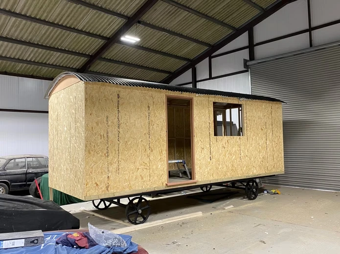 Wooden building on a trailer.