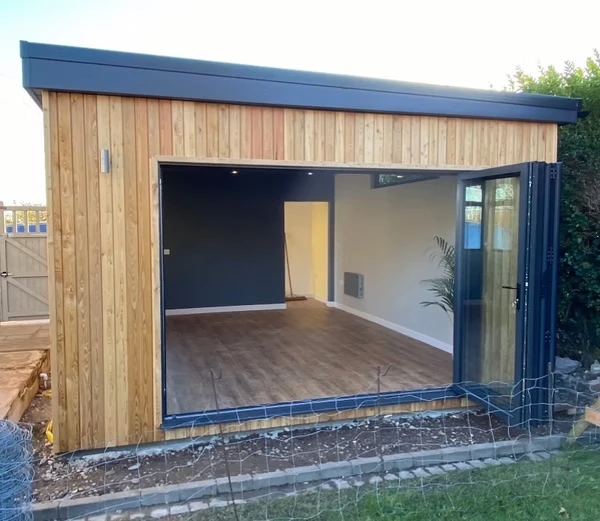 Wooden outdoor office with folding doors.